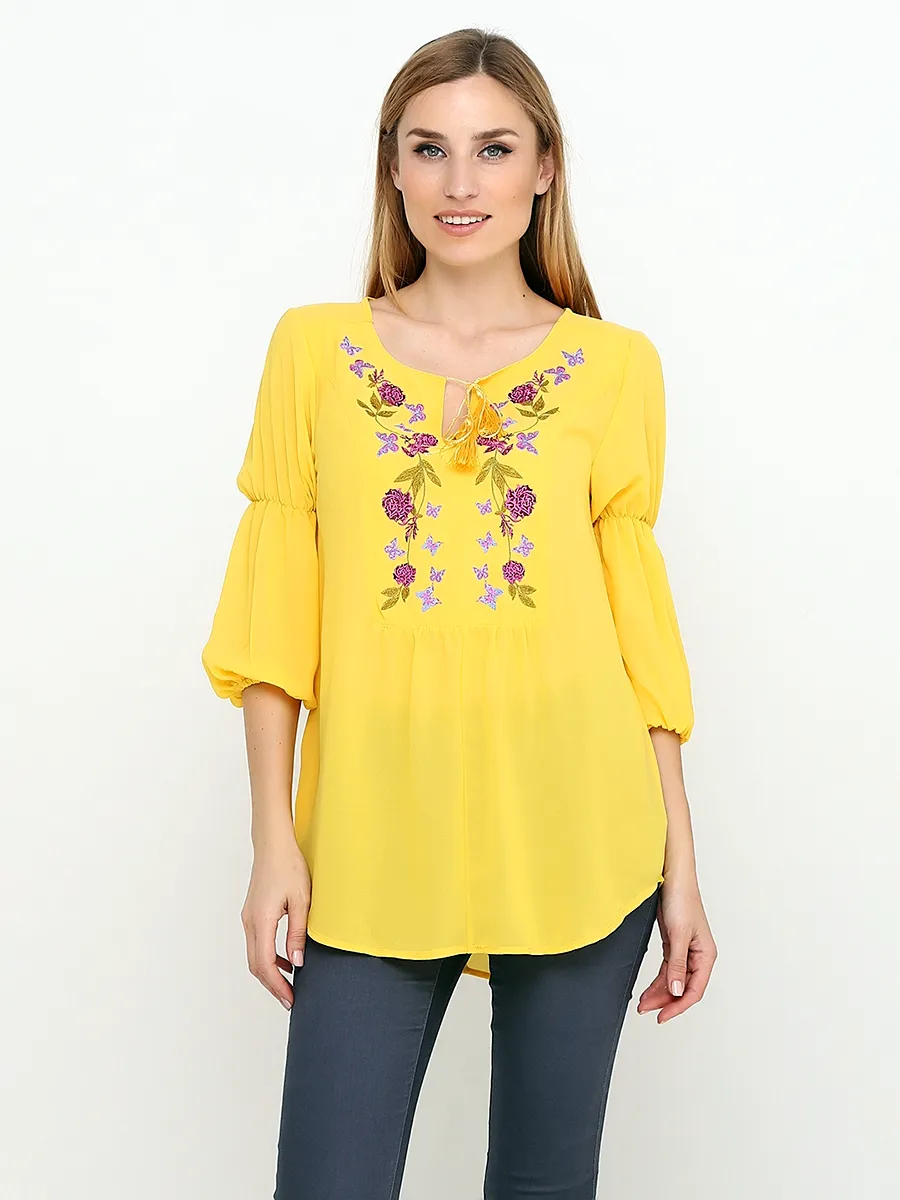 Вышивка на желтой блузке