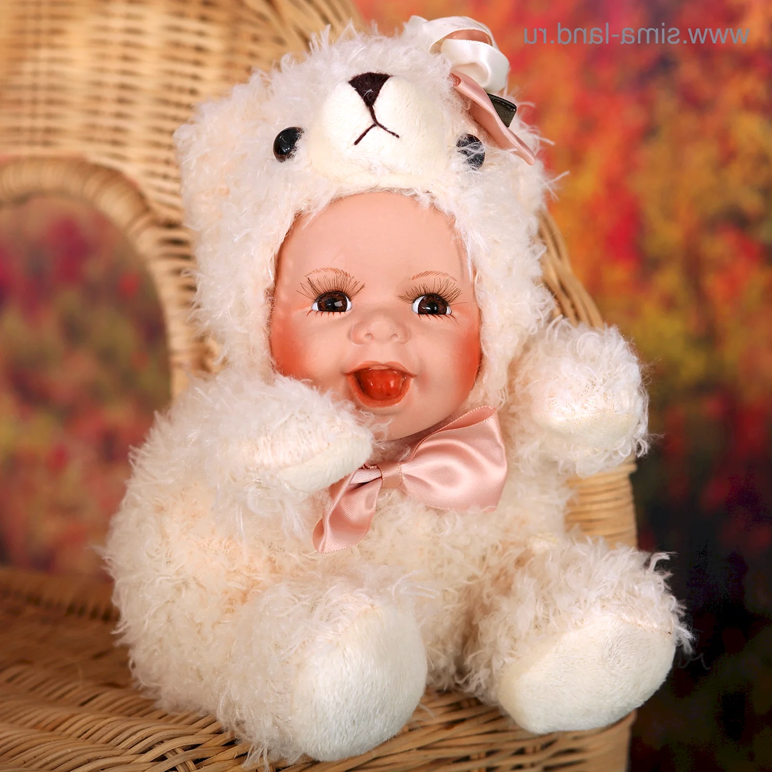 Кукла коллекционная малыш в костюме мишки
